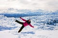 Young attractive woman, skiing in Austrian ski resort on a sunny Royalty Free Stock Photo