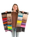 Young attractive woman in sweater holding fabric swatches Royalty Free Stock Photo