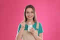 Young attractive woman with tasty yogurt on background