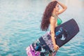 Young attractive woman with wakeboard Royalty Free Stock Photo