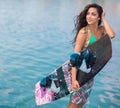 Young attractive woman with wakeboard Royalty Free Stock Photo