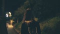 Young attractive woman walking late at night alone in Rome, Italy. Girl goes through the city centre near the Colosseum. Royalty Free Stock Photo