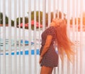 Young attractive woman with waving long hair playing on summer. Happiness and craziness. Smiling crazy girl have fun. Royalty Free Stock Photo