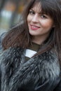 Young attractive woman wearing fur, autmn outside