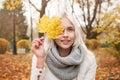 Young Autumn Woman with Yellow Maple Autumn Leaves