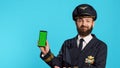 Young aviator using greenscreen dressed as captain