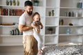 Young awesome father holding his kid, playing with her, singing sons together Royalty Free Stock Photo