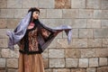 Young azeri woman in traditional Azerbaijani dress is dancing traditional azeri dance