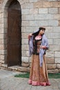 Young azeri woman in traditional Azerbaijani dress is dancing traditional azeri dance