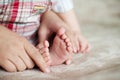 Young baby foot. Newborn boy indoors