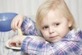 Young baby girl eating breakfast sandwich Royalty Free Stock Photo