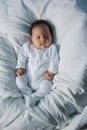 A young baby sleeping peacefully in a couch, white background Royalty Free Stock Photo
