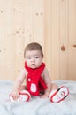 Young baby wearing a santa claus suit and hat in christmas in a barn Royalty Free Stock Photo