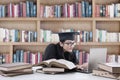 Young bachelor studying in library 3 Royalty Free Stock Photo