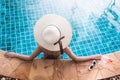 Young back woman in bikini luxury swimming pool drink cocktail