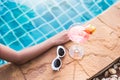 Young back woman in bikini luxury swimming pool drink cocktail