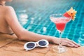 Young back woman in bikini swimming pool drink cocktail,