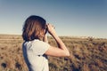 Young Backpack Traveler Using Binoculars