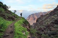 Young backpacker trekking in the canyon on Gran Canaria.