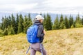 Young backpacker woman enjoying mountain trip Royalty Free Stock Photo