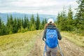 Young backpacker woman enjoying mountain trip Royalty Free Stock Photo