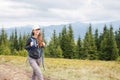 Young backpacker woman enjoying mountain trip Royalty Free Stock Photo