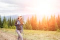 Young backpacker woman enjoying mountain trip Royalty Free Stock Photo