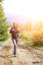 Young backpacker woman enjoying mountain trip Royalty Free Stock Photo