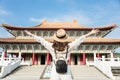 Young backpacker woman stand before traditional chinese temple