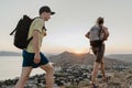 Young backpackers on mountain hiking enjoying their vacation journey