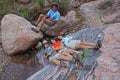 Young backpackers resting in Hance Creek in the Grand Canyon.