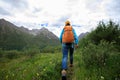 Young backpacking woman hiking