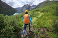 Woman walking in high altitude mountains Royalty Free Stock Photo