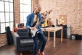 Young bald man musician playing electrical guitar standing at music studio Royalty Free Stock Photo