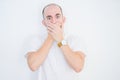 Young bald man over white isolated background shocked covering mouth with hands for mistake Royalty Free Stock Photo