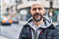 Young bald man smiling confident standing at street Royalty Free Stock Photo