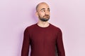 Young bald man wearing casual clothes smiling looking to the side and staring away thinking Royalty Free Stock Photo