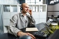 Young bald man working in a call center office Royalty Free Stock Photo