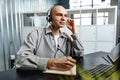Young bald man working in a call center office Royalty Free Stock Photo