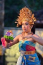 Young Balinese female dancer performing traditional dance