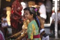 A young Balinese girl in traditional clothes on Hindu Temple ceremony, Bali Island, Indonesia