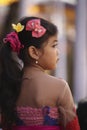 A young Balinese girl in traditional clothes on Hindu Temple ceremony, Bali Island, Indonesia