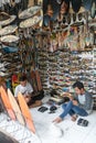 Young balinese men making handmade souvenir surf boards in their souvenir shop on Bali, Indonesia