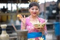 Young Balinese woman praying