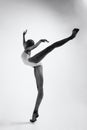 young ballerina in a bodysuit performs an attitude Royalty Free Stock Photo