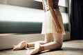 Young ballerina girl kneeled on the floor Royalty Free Stock Photo