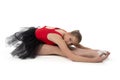 Young ballerina makes stretching exercises