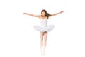 young ballerina with open arms jumping and looking down Royalty Free Stock Photo