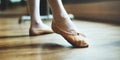 Young ballerina`s feet wearing ballet shoes