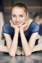 Young ballerina sitting on the floor with his face to the camera Royalty Free Stock Photo